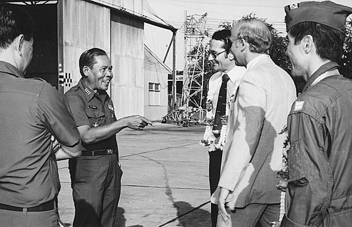 1979, Bangkok RTAF Base.  Joyful greeting from Colonel Cherd to me and fellow pilot Neil Morris.